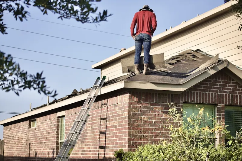 Professional roofer working on a residential roof in Chicago Heights